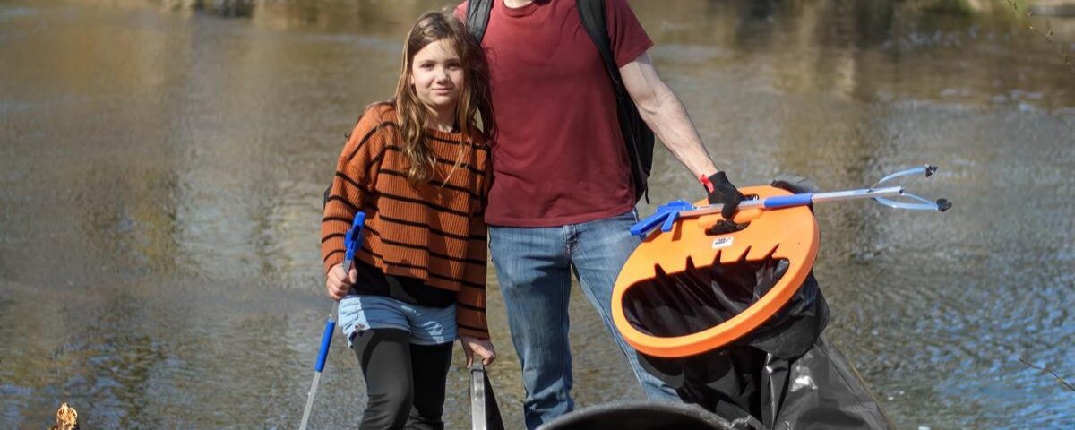 Volunteers in Montgomery County clean up litter along a waterway for the Pick Up PA program.