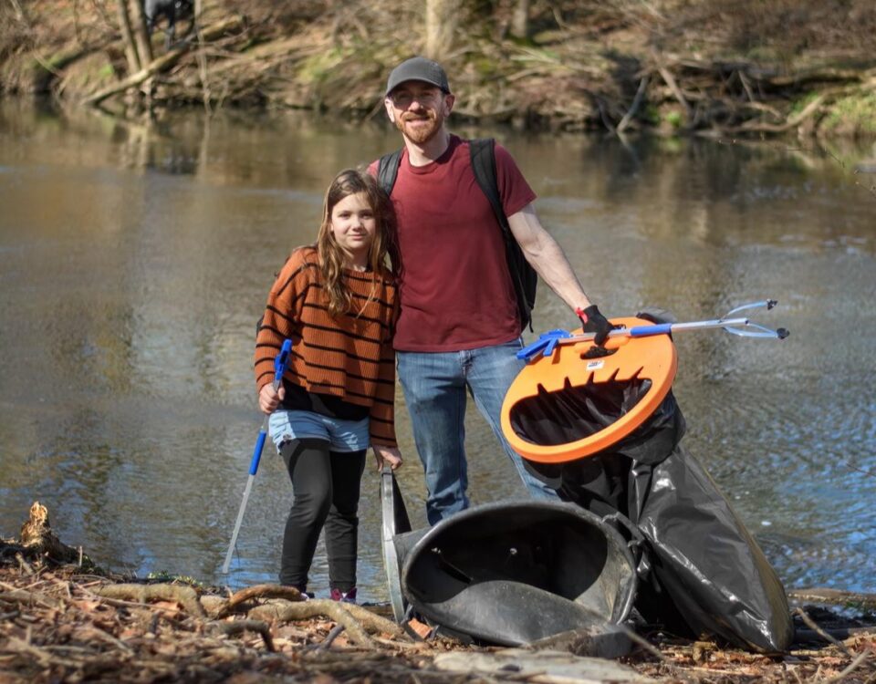 Volunteers in Montgomery County clean up litter along a waterway for the Pick Up PA program.